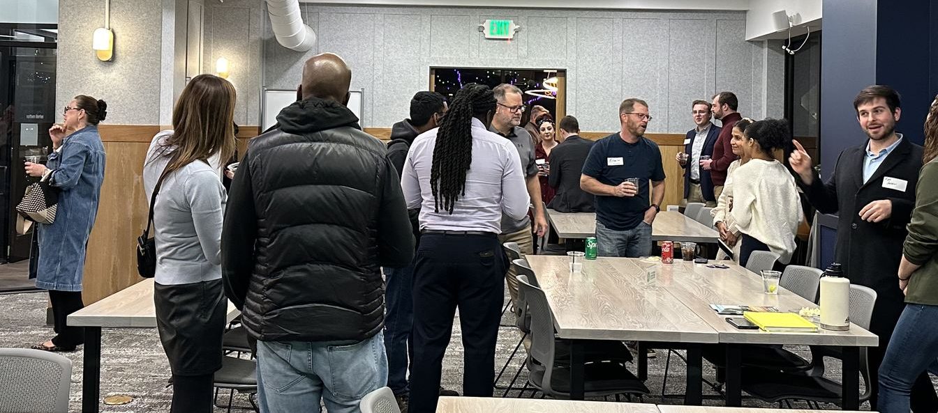 Business professionals and entrepreneurs connecting at a Connect Cincy networking event at COhatch in Over-the-Rhine